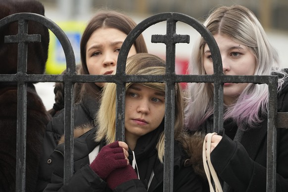 People gather outside the Church of the Icon of the Mother of God Soothe My Sorrows, in Moscow, Russia, Friday, March 1, 2024. Relatives and supporters of Alexei Navalny are bidding farewell to the op ...