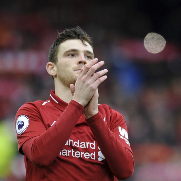Liverpool's Andrew Robertson applauds to supporters before the English Premier League soccer match between Liverpool and Tottenham Hotspur at Anfield stadium in Liverpool, England, Sunday, March ...