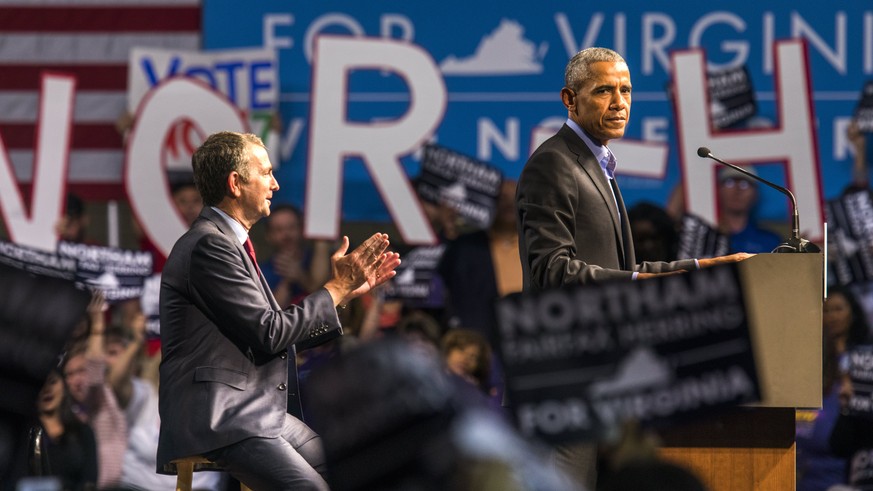epa06277428 Former US President Barack Obama (R) campaigns with Virginia Democratic gubernatorial candidate Lt. Governor Ralph Northam (L) at the Richmond Convention Center in Richmond, Virginia, USA, ...