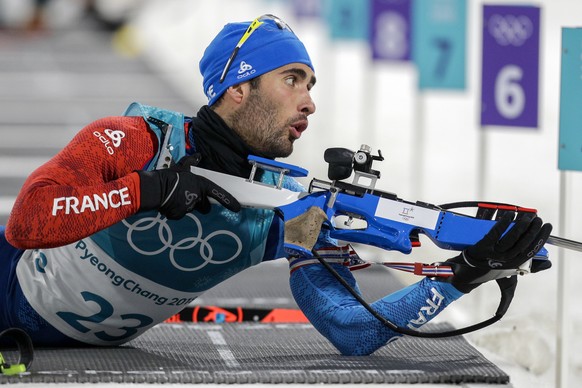 Martin Fourcade, of France, looks at the target before shooting during the men&#039;s 20-kilometer individual biathlon at the 2018 Winter Olympics in Pyeongchang, South Korea, Thursday, Feb. 15, 2018. ...