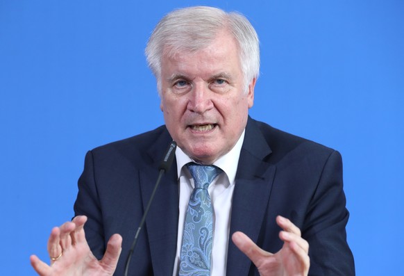 epa07748607 Minister of Interior, Construction and Homeland Horst Seehofer speaks during a press conference reporting on the incident at the Frankfurt main station, in Berlin, Germany, 30 July 2019. A ...