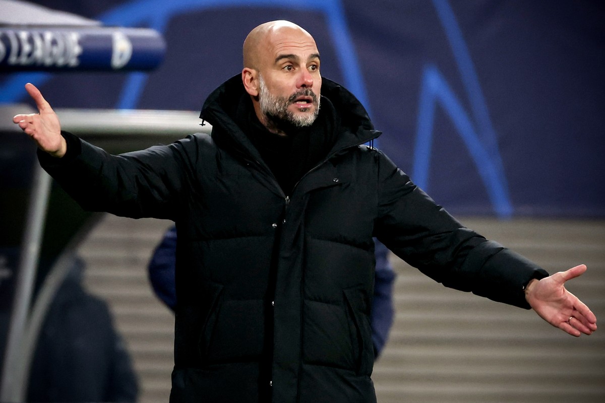 epa09627824 Manchester City's head coach Pep Guardiola reacts during the UEFA Champions League group A soccer match between RB Leipzig and Manchester City at Red Bull Arena in Leipzig, Germany, 0 ...
