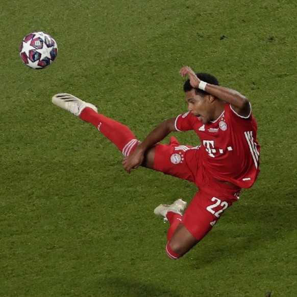 Bayern&#039;s Serge Gnabry, left, flights for the ball besides PSG&#039;s Juan Bernat during the Champions League final soccer match between Paris Saint-Germain and Bayern Munich at the Luz stadium in ...