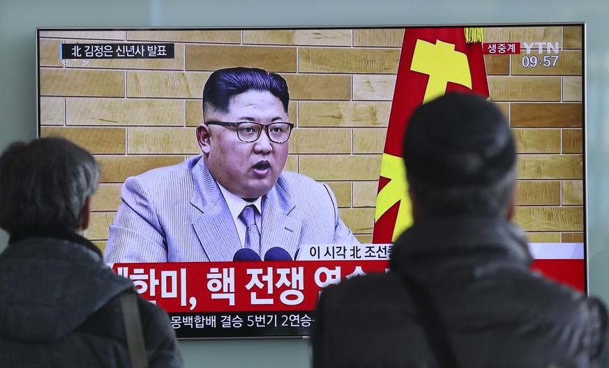 South Koreans watch a TV news program showing North Korean leader Kim Jong Un&#039;s New Year&#039;s address, at the Seoul Railway Station in Seoul, South Korea, Monday, Jan. 1, 2018. The part of lett ...