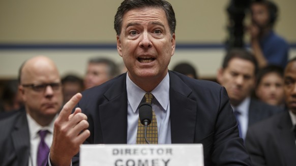 FILE - In this July 7, 2016, file photo, FBI Director James Comey testifies before the House Oversight Committee about Hillary Clinton&#039;s email investigation, at the Capitol in Washington. Text me ...