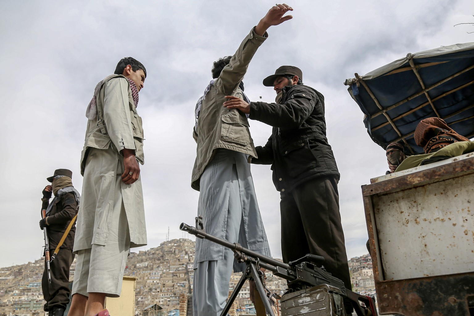 epa11231460 Taliban security members check people during Nowruz celebrations, the Persian New Year, in Kabul, Afghanistan, 20 March 2024. Nowruz, which this year falls on 20 March has been celebrated  ...