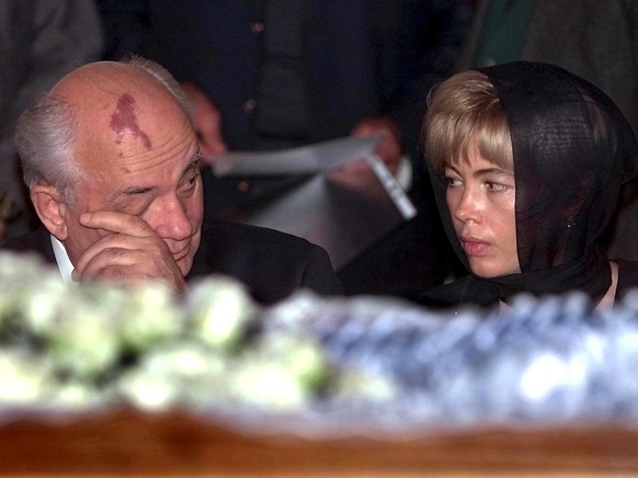 epa10148345 (FILE) - Former Soviet leader Mikhail Gorbachev (L) wips his eye while his daughter Irina and him sit behind the coffin of their late wife and mother Raisa Gorbacheva during a seeing off c ...