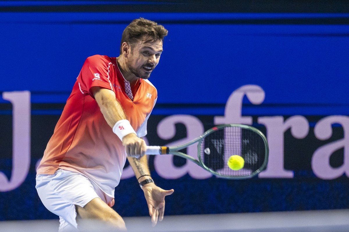 Switzerland's Stan Wawrinka returns a ball to Czech Republic's Jiri Lehecka during their first round match at the Swiss Indoors tennis tournament at the St. Jakobshalle in Basel, Switzerland ...