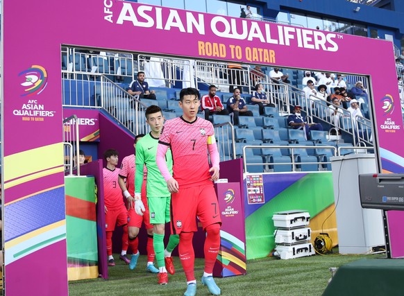 epa09858280 Team captain Son Heung Min of South Korea leads his teammates onto the pitch before the FIFA World Cup 2022 Qualifiers soccer match between the UAE and South Korea in Dubai, United Arab Em ...