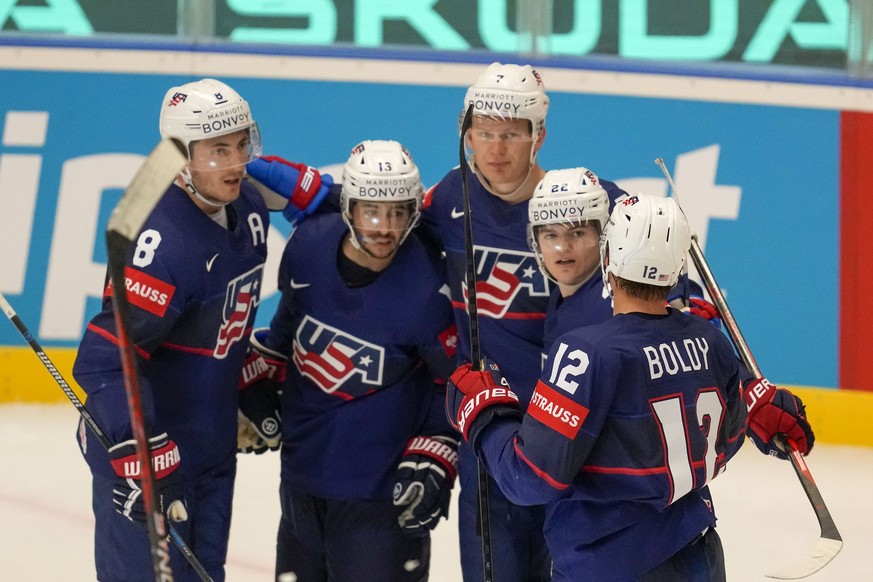 Unted States&#039; Johnny Gaudreau celebrates with teammates after scoring his side&#039;s third goal during the preliminary round match between United States and Germany at the Ice Hockey World Champ ...