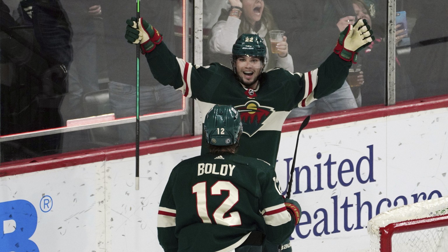 Minnesota Wild&#039;s Kevin Fiala, top, celebrates his game-tying goal off San Jose Sharks goalie James Reimer in the third period of an NHL hockey game, Sunday, April 17, 2022, in St. Paul, Minn. The ...