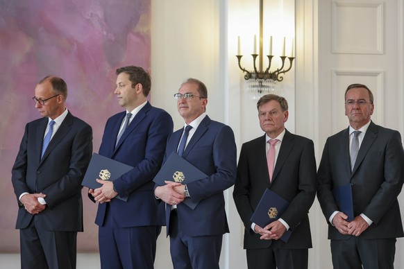 epa12078194 (L-R) German Chancellor Friedrich Merz, Finance Minister Lars Klingbeil, Interior Minister Alexander Dobrindt, Foreign Minister Johann Wadephul, and Defense Minister Boris Pistorius hold t ...
