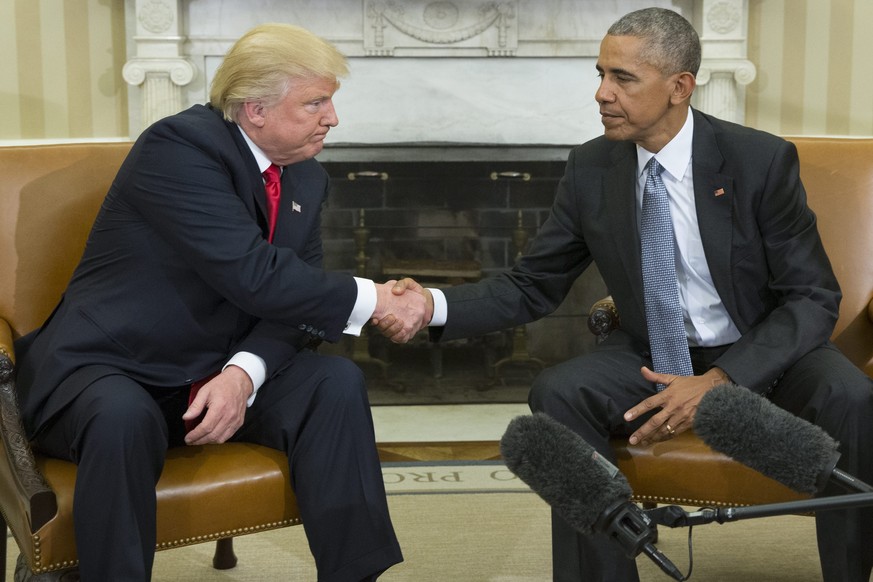 epa05706708 (FILE) A file picture dated 10 November 2016 shows US President Barack Obama (R) as he shakes hands with President-elect Donald Trump (L) at the end of their meeting in the Oval Office of  ...