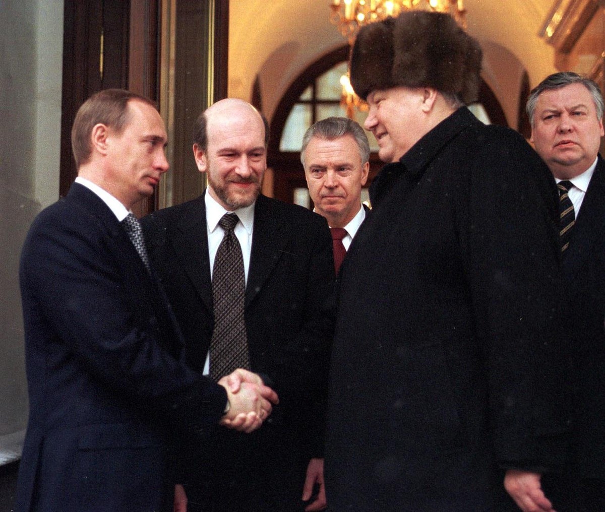 Resigned Russian President Boris Yeltsin (R) shakes hands with Prime Minister and acting President Vladimir Putin (L) as he is leaving his office in the Moscow Kremlin on Friday 31 December 1999, as t ...
