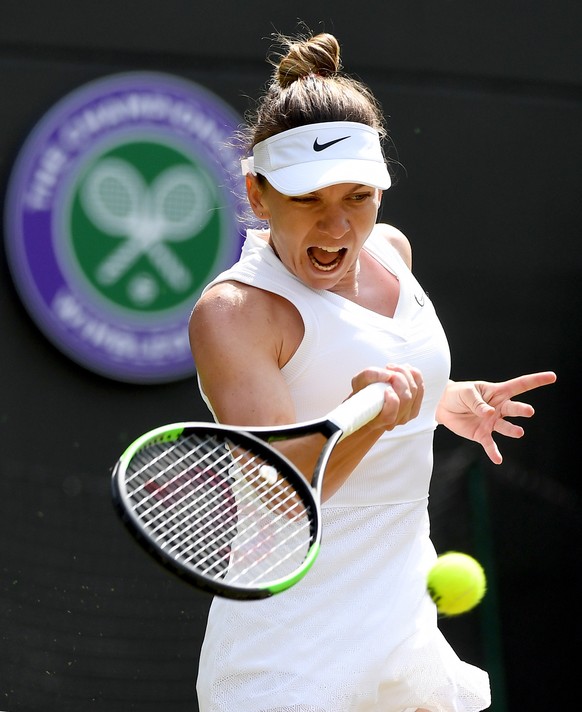 epa07703661 Simona Halep of Romania in action against Cori Gauff of the USA during their fourth round match for the Wimbledon Championships at the All England Lawn Tennis Club, in London, Britain, 08 ...