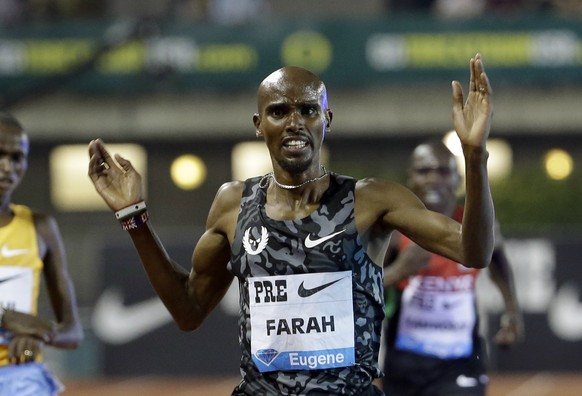 Mo Farah, from Britain, crosses the finish line to win the 10,000-meter race during the Prefontaine Classic track and field meet in Eugene, Ore., Friday, May 29, 2015. Farah finished with a time of 26 ...