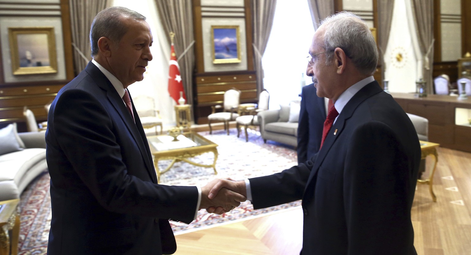 FILE - Turkey&#039;s President Recep Tayyip Erdogan, left, greets Kemal Kilicdaroglu, leader of the main opposition Republican People&#039;s Party, CHP, before a meeting in Ankara, Turkey, Monday, Jul ...