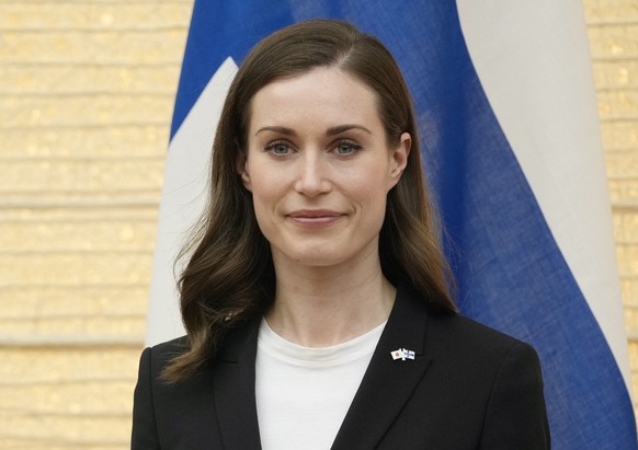 epa09939756 Finland&#039;s Prime Minister Sanna Marin attends a signing ceremony at Japan?s Prime Minister (not pictured) official residence in Tokyo, Japan, 11 May 2022. Both parties signed a working ...