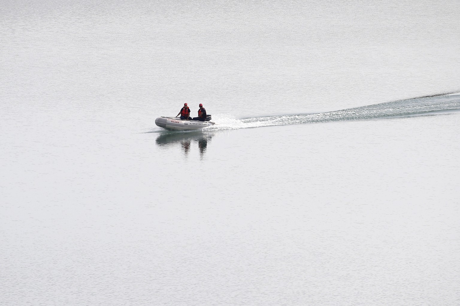 A police dingy navigates in the Arade dam near Silves, Portugal, Tuesday May 23, 2023. Portuguese police said they will resume searching for Madeleine McCann, the British toddler who disappeared in th ...