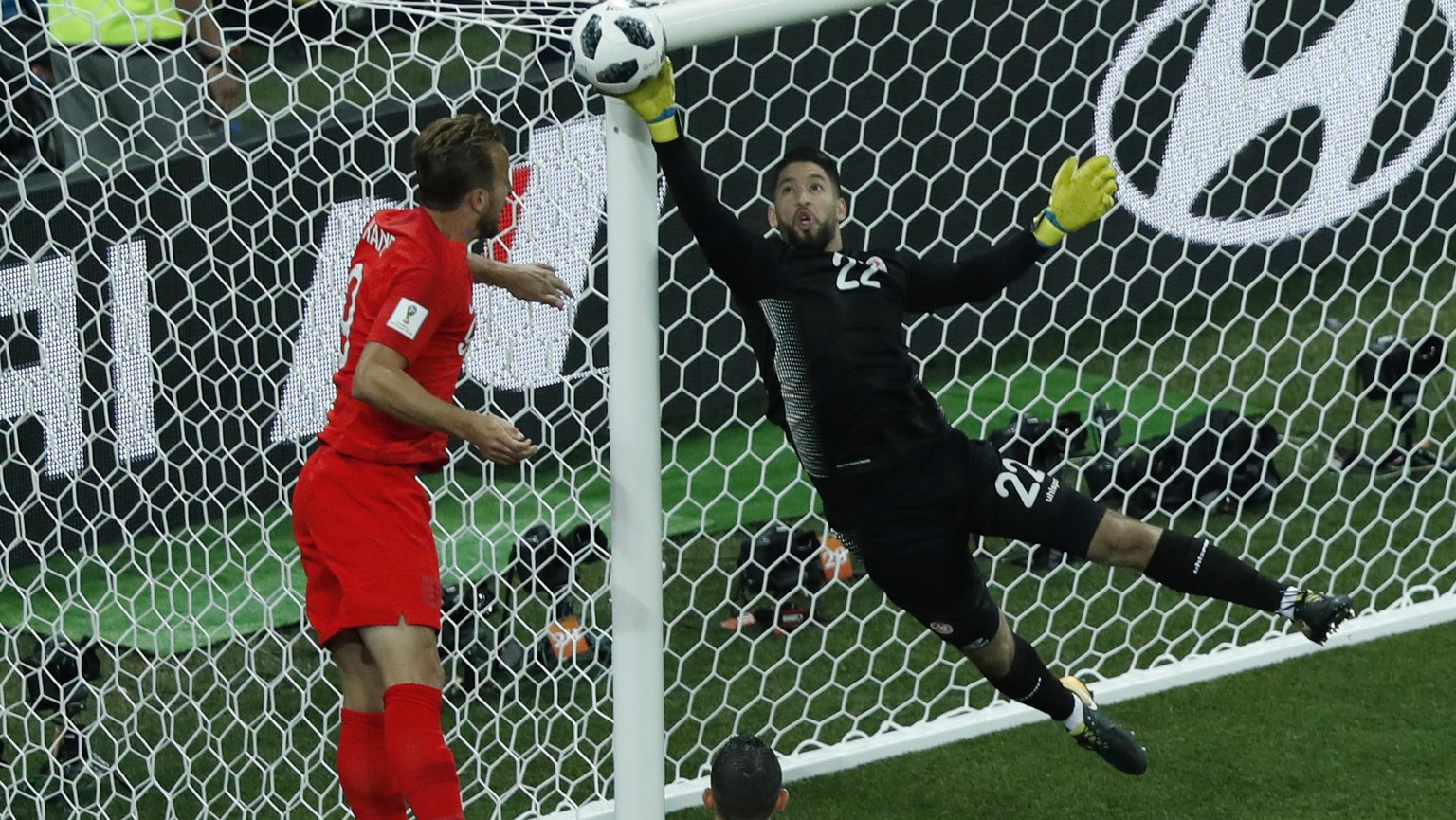 Tunisia goalkeeper Mouez Hassen, right, and England&#039;s Harry Kane fight for the ball during the group G match between Tunisia and England at the 2018 soccer World Cup in the Volgograd Arena in Vol ...