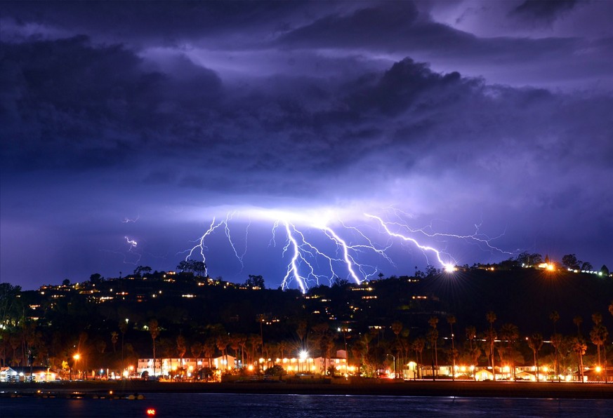 epa07416340 A handout photo made available by the Santa Barbara County Fire Department shows lightning strikes in the skies as a storm approaches Santa Barbara, California, USA, 05 March 2019. The San ...