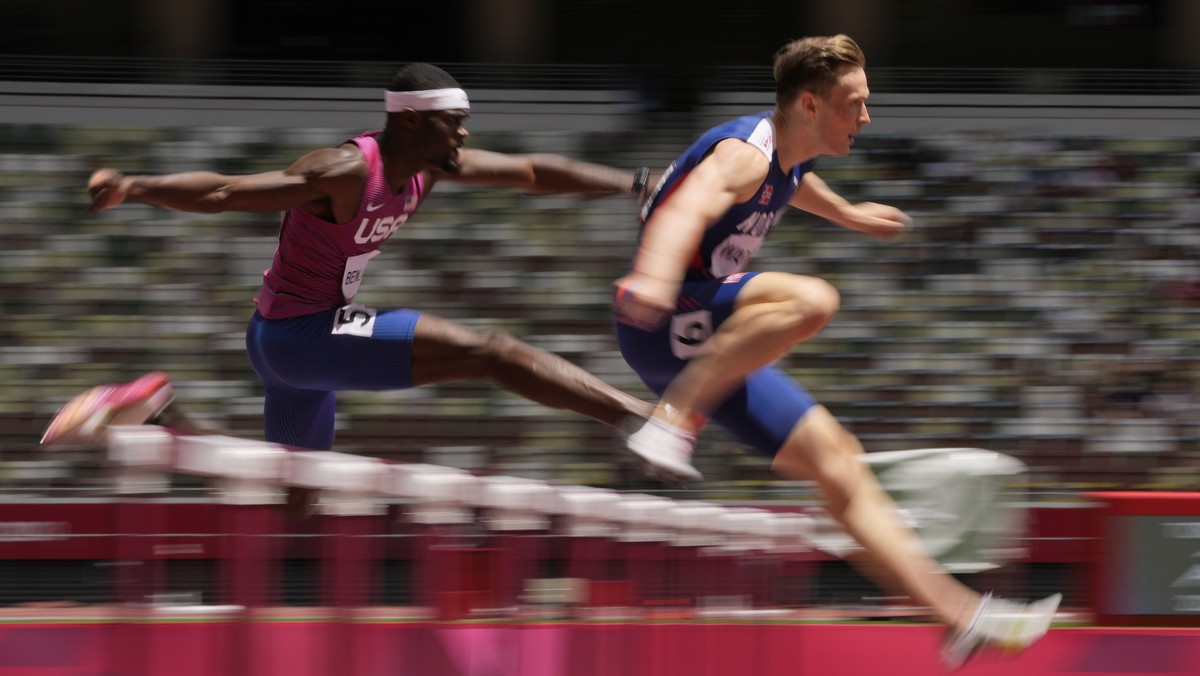 Karsten Warholm, right, of Norway, leads Rai Benjamin, of United States, in the final of the men's 400-meter hurdles at the 2020 Summer Olympics, Tuesday, Aug. 3, 2021, in Tokyo. (AP Photo/Franci ...