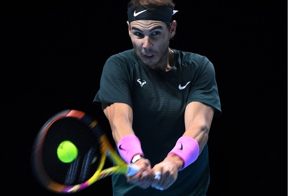 epa08834929 Rafael Nadal of Spain in action against Daniil Medvedev of Russia during their semi final match at the ATP World Tour Finals tennis tournament in London, Britain, 21 November 2020. EPA/AND ...