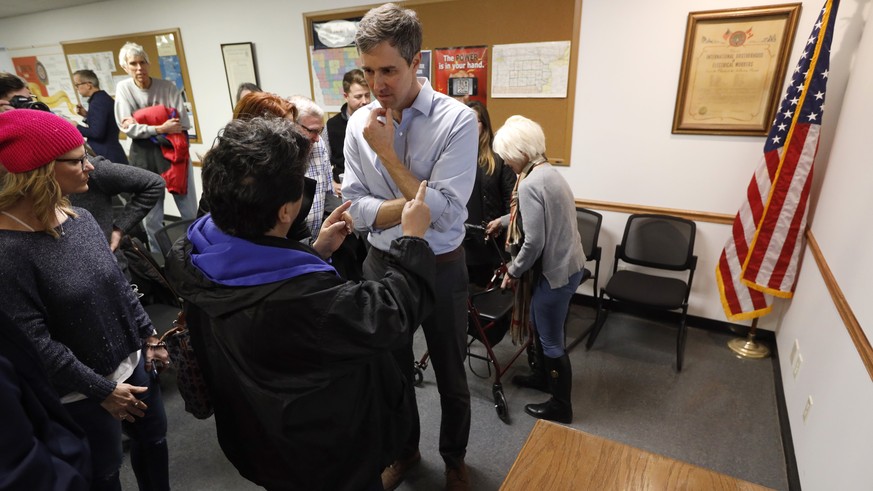 Former Texas congressman Beto O&#039;Rourke talks with an audience member after speaking at the International Brotherhood of Electrical Workers Local 13 hall, Thursday, March 14, 2019, in Burlington,  ...