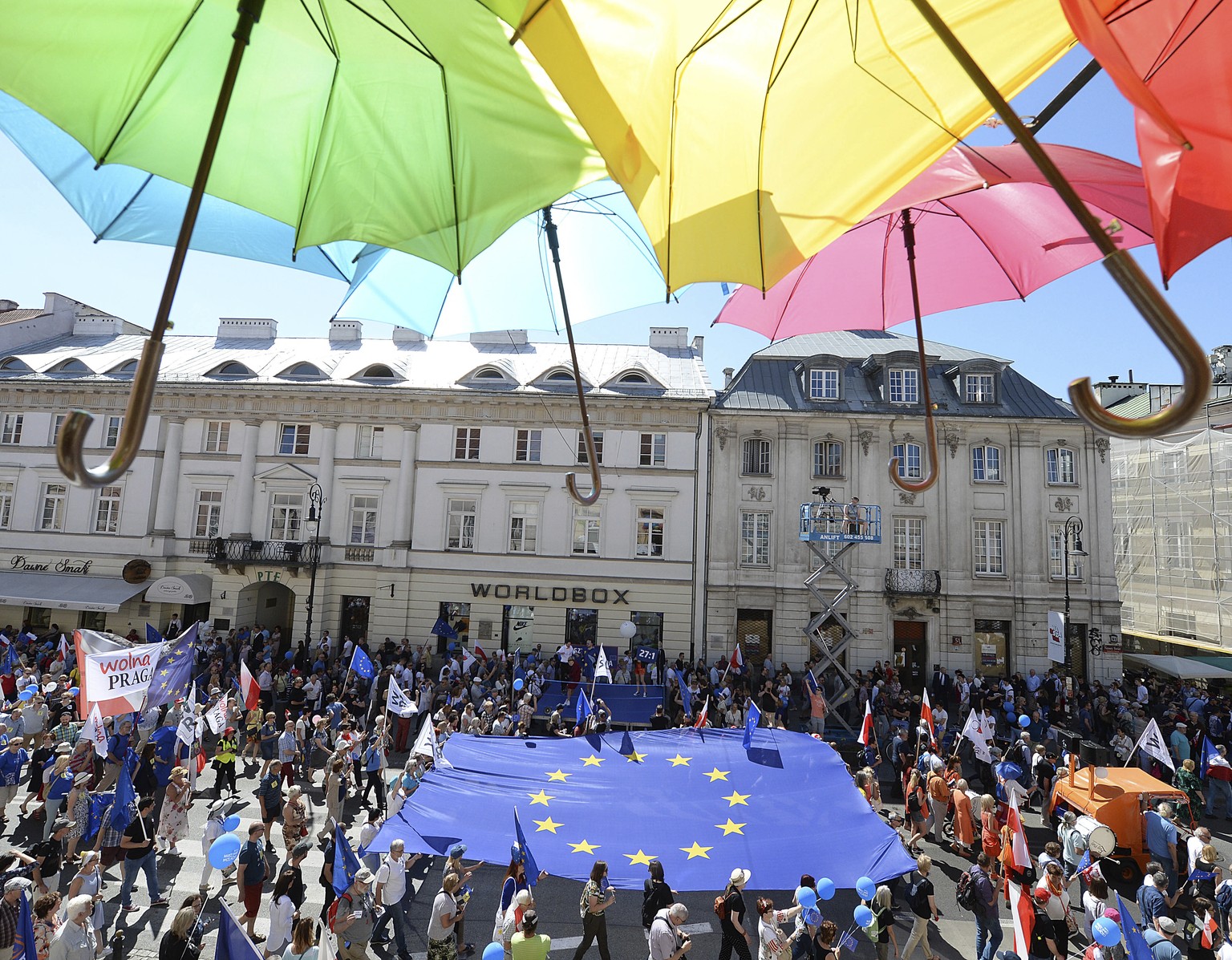 People hold a European flag as they take part in a demonstration during an anti-government protest, called &#039;Freedom March&#039; and organized by opposition parties, in Warsaw, Poland, Saturday, M ...