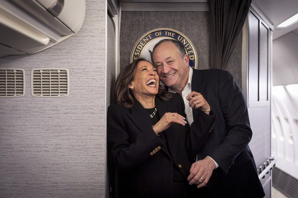 Democratic presidential nominee Vice President Kamala Harris, left, shares a laugh with second gentleman Doug Emhoff, after reuniting in Pittsburgh, Monday, Nov. 4, 2024, aboard Air Force Two, just be ...