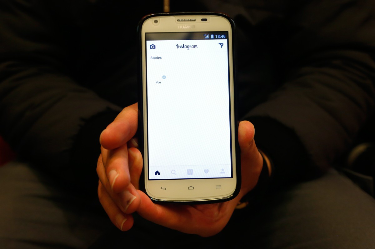 epa06413474 An Iranian man shows his social media page which doesn't work in a office in Tehran, Iran, 02 January 2018. Media reported that due to anti-government protest in Iran, Iranian governm ...