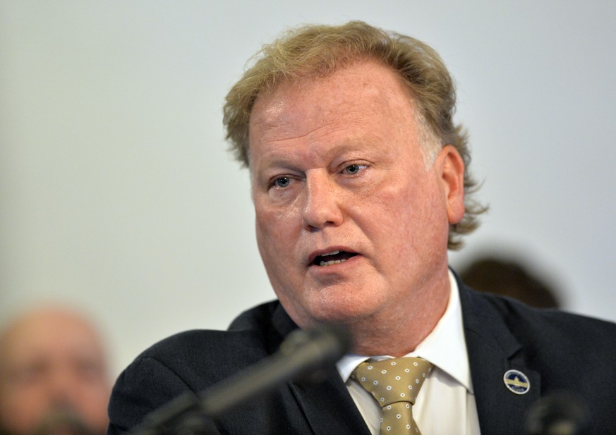 CORRECTS TO A PROBABLE SUICIDE INSTEAD OF COMMITTED SUICIDE FILE - In this Tuesday, Dec. 12, 2017, file photo, Kentucky State Rep. Republican Dan Johnson addresses the public from his church regarding ...