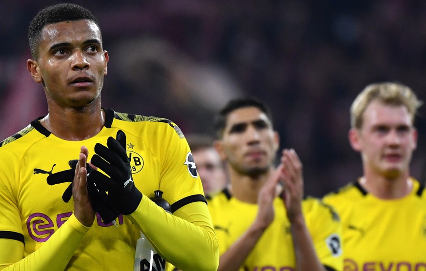 epa07984573 Dortmund&#039;s Manuel Akanji (L) reacts after the German Bundesliga soccer match between FC Bayern and Borussia Dortmund in Munich, Germany, 09 November 2019. EPA/PHILIPP GUELLAND CONDITI ...