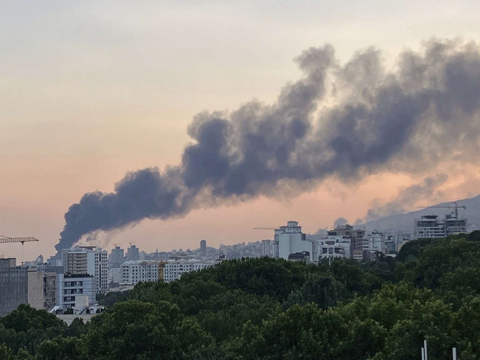 Smoke rises from the building of Iran&#039;s state-run television after an Israeli strike in Tehran, Iran, Monday, June 16, 2025. (AP Photo)
Iran Israel Mideast Wars