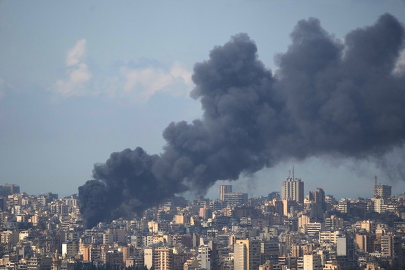 KEYPIX - Smoke rises following an Israeli airstrike on a building in Beirut, Lebanon, Wednesday, April 8, 2026. (AP Photo/Hassan Ammar)