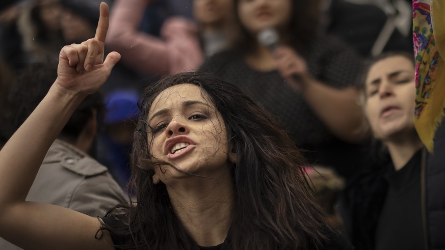 A woman shouts during a protest against the death of Iranian Mahsa Amini, in Zurich, Switzerland, on Saturday October 1, 2022. Amini, a 22-year-old woman who died in Iran while in police custody, was ...