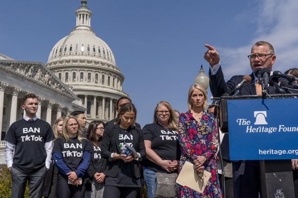 Rep.  Troy Nehls, R-Texas, far right, joined by Rep.  Mary Miller, R-Ill., second from right, calls for TikTok, the hugely popular video-sharing app, to be banned at the Capitol in Washington, Thursda…