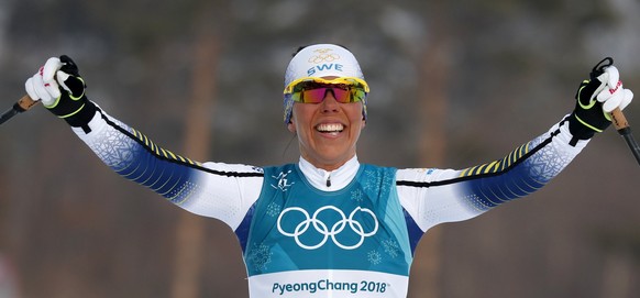 epa06510485 Charlotte Kalla of Sweden celebrates winning the Women&#039;s Cross Country 7,5 km + 7,5 km Skiathlon race at the Alpensia Cross Country Centre during the PyeongChang 2018 Olympic Games, S ...