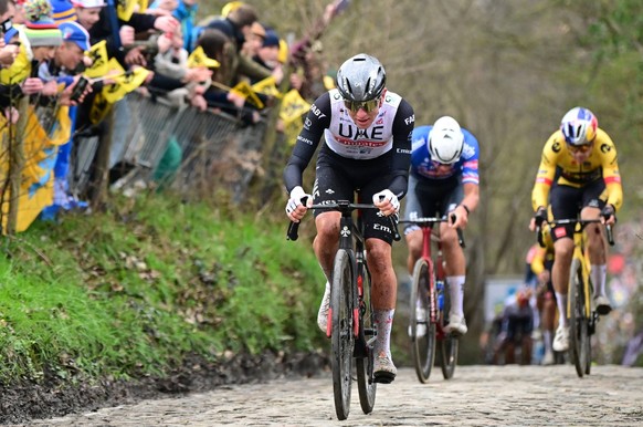 Slovenian Tadej Pogacar of UAE Team Emirates, Belgian Wout van Aert of Team Jumbo-Visma and Dutch Mathieu van der Poel of Alpecin-Deceuninck pictured in action during the men s race of the Ronde van V ...