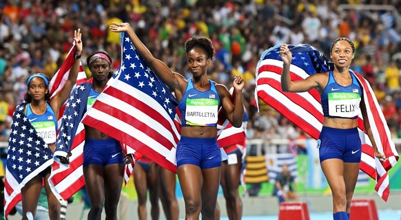 epa05501489 (L-R) English Gardner, Tori Bowie, Tianna Bartoletta, and Allyson Felix of the USA celebrate after winning the women&#039;s 4x100m relay final of the Rio 2016 Olympic Games Athletics, Trac ...