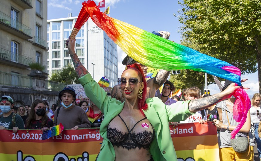 epa09461602 People walk through the streets for the rights of the LGBTIQ+ community during the Geneva Pride march, in Geneva, Switzerland, 11 September 2021. EPA/SALVATORE DI NOLFI