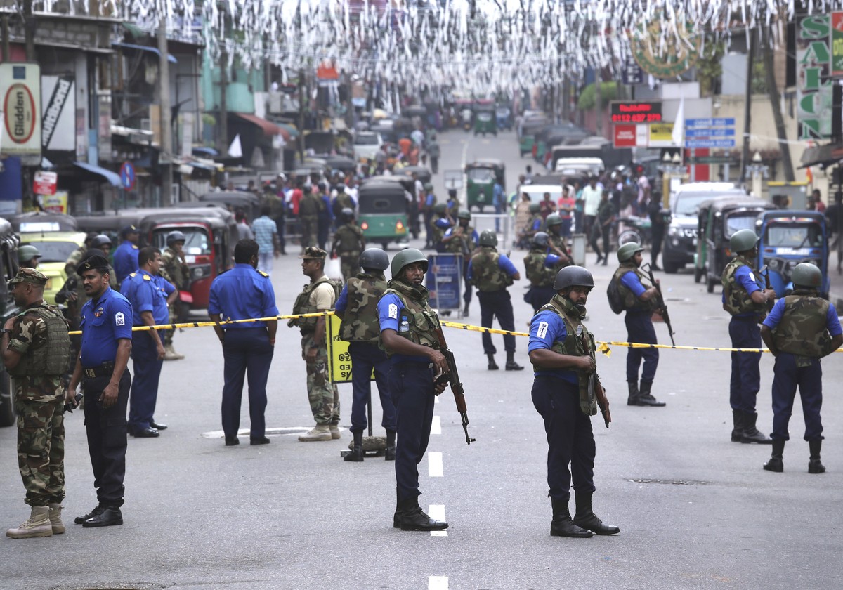 Sri Lankan Naval soldiers stand guard as authorities started clearing the debris from inside of the damaged St. Anthony's Church after it was targeted in a series of Islamic State-claimed suicide ...