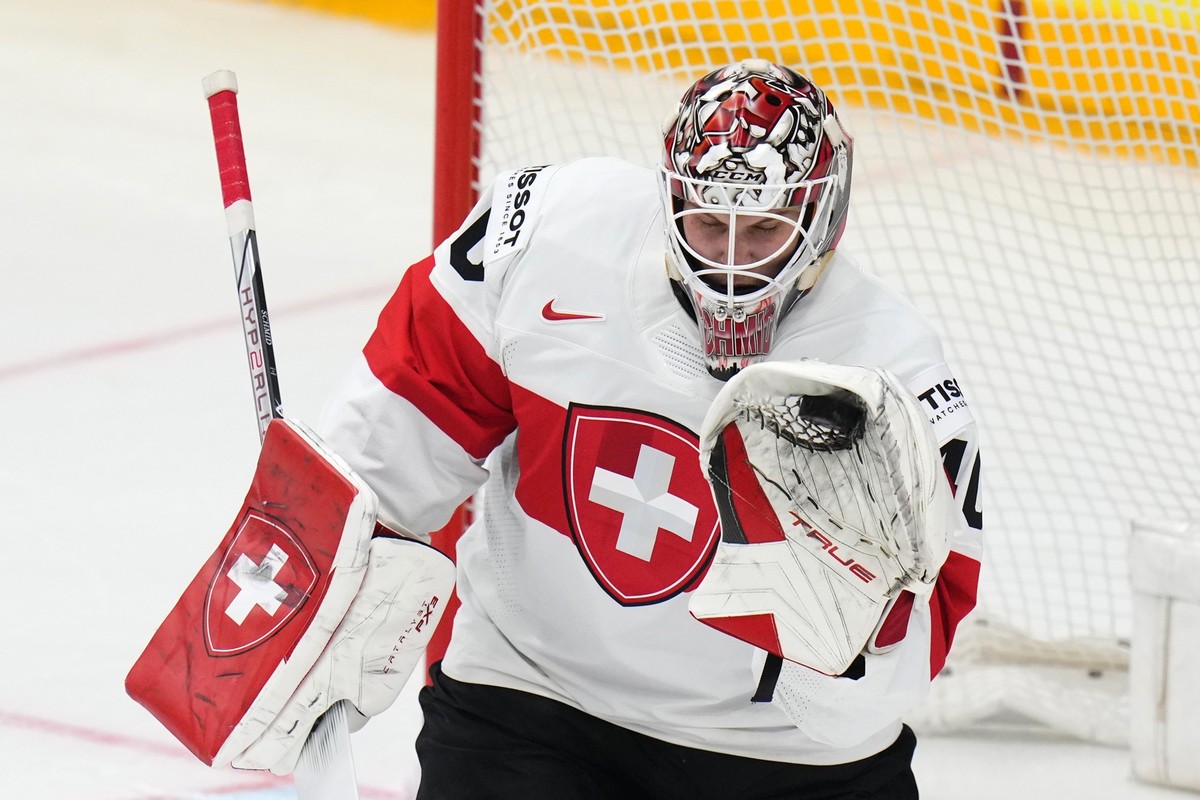 Switzerland's Akira Schmid makes a save during the preliminary round match between Finland and Switzerland at the Ice Hockey World Championships in Prague, Czech Republic, Tuesday, May 21, 2024.  ...