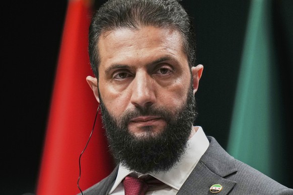 FILE - Syria&#039;s interim President Ahmad al-Sharaa, looks on during a joint press conference with Turkish President Recep Tayyip Erdogan at the presidential palace in Ankara, Turkey, Feb. 4, 2025.  ...
