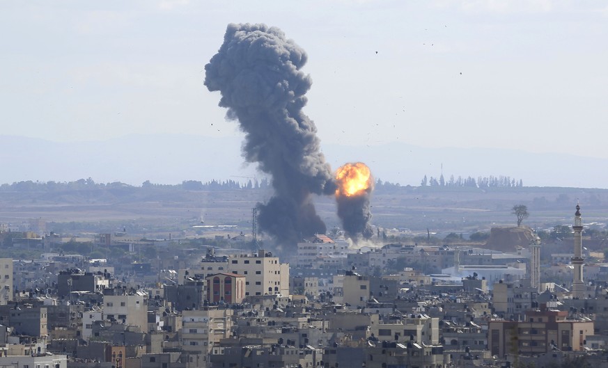 Smoke rises from an explosion caused by an Israeli airstrike in Gaza City, Saturday, Oct. 27, 2018. Israeli aircraft struck several militant sites across the Gaza Strip early Saturday shortly after mi ...