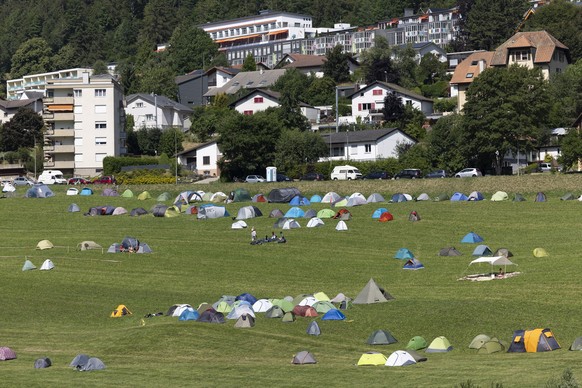 epa10755286 Tents of the participants stand awwn in the camping area during the international anti-authoritarian meeting Anarchy 2023 in St-Imier, Switzerland, July 19, 2023. The meeting takes place ...