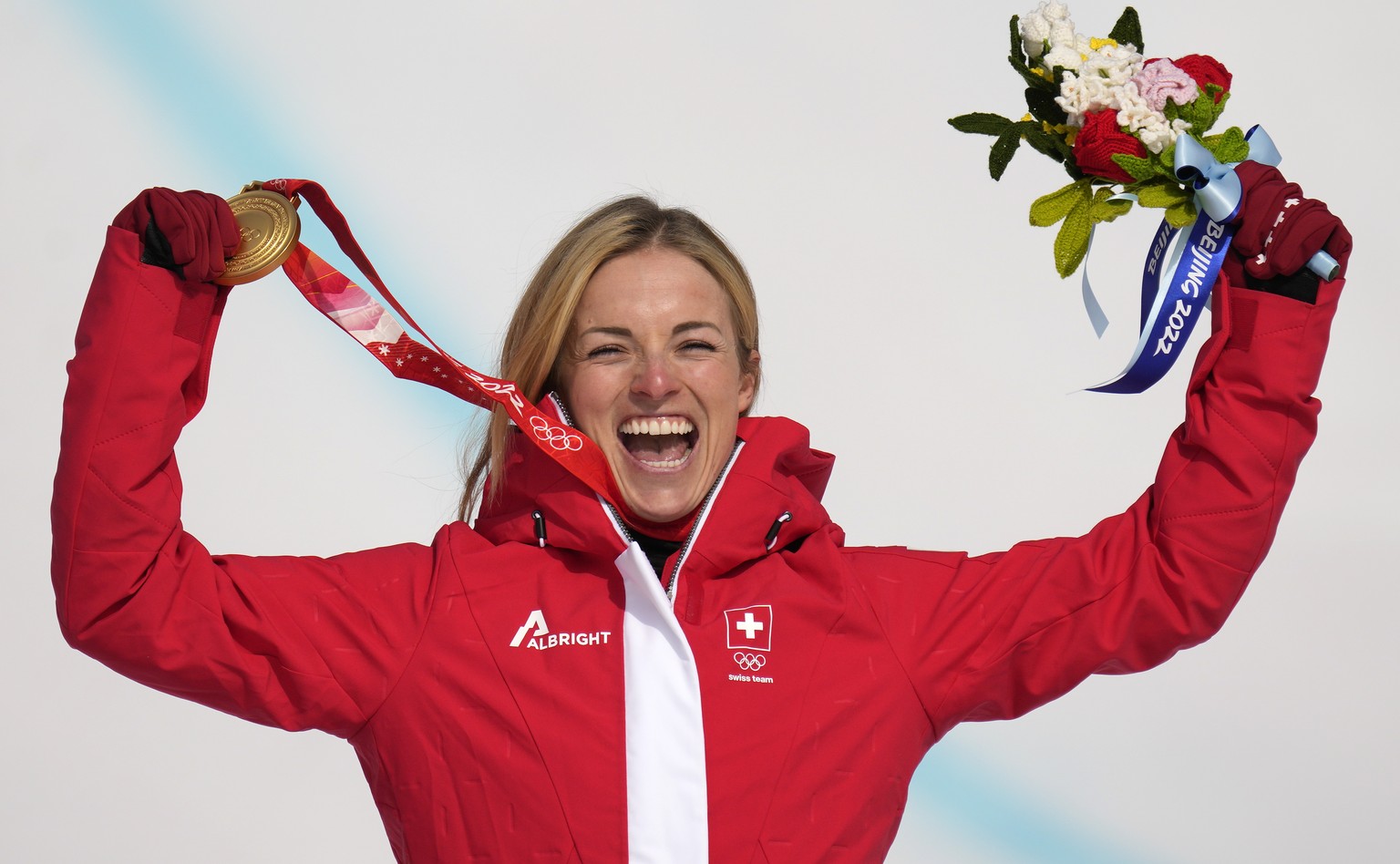 Lara Gut-Behrami, of Switzerland celebrates during the medal ceremony after winning the gold medal in the women&#039;s super-G at the 2022 Winter Olympics, Friday, Feb. 11, 2022, in the Yanqing distri ...