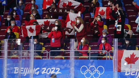 Fans for Team Canada cheer during the women&#039;s gold medal hockey game between Canada and the United States at the 2022 Winter Olympics, Thursday, Feb. 17, 2022, in Beijing. (AP Photo/Matt Slocum)