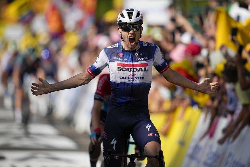 Denmark&#039;s Kasper Asgreen crosses the finish line to win the eighteenth stage of the Tour de France cycling race over 185 kilometers (115 miles) with start in Moutiers and finish in Bourg-en-Bress ...