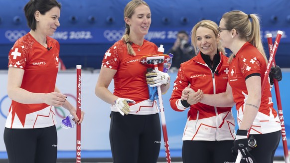 Switzerland skip Silvana Tirinzoni, 2nd right, and her teammates Esther Neuenschwander, left, Melanie Barbezat, 2nd left, and Alina Paetz, right, celebrate after defeating the South Korea team during  ...